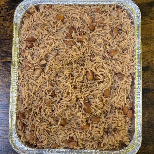 HALFOF TRAY RICE AND BEANS.